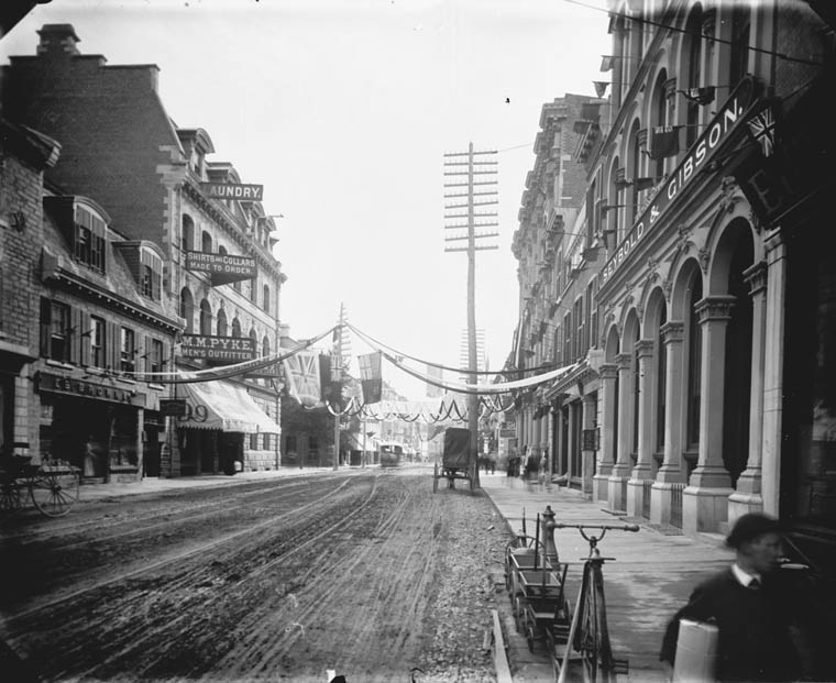 Sparks Street, July 25, 1885 with decorations to welcome back volunteers in the Northwest Rebellion.